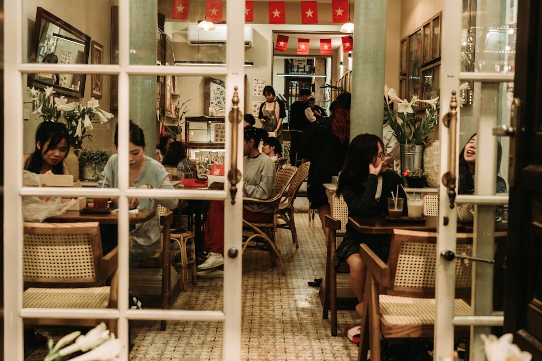 Two people having a friendly conversation at a coffee shop table