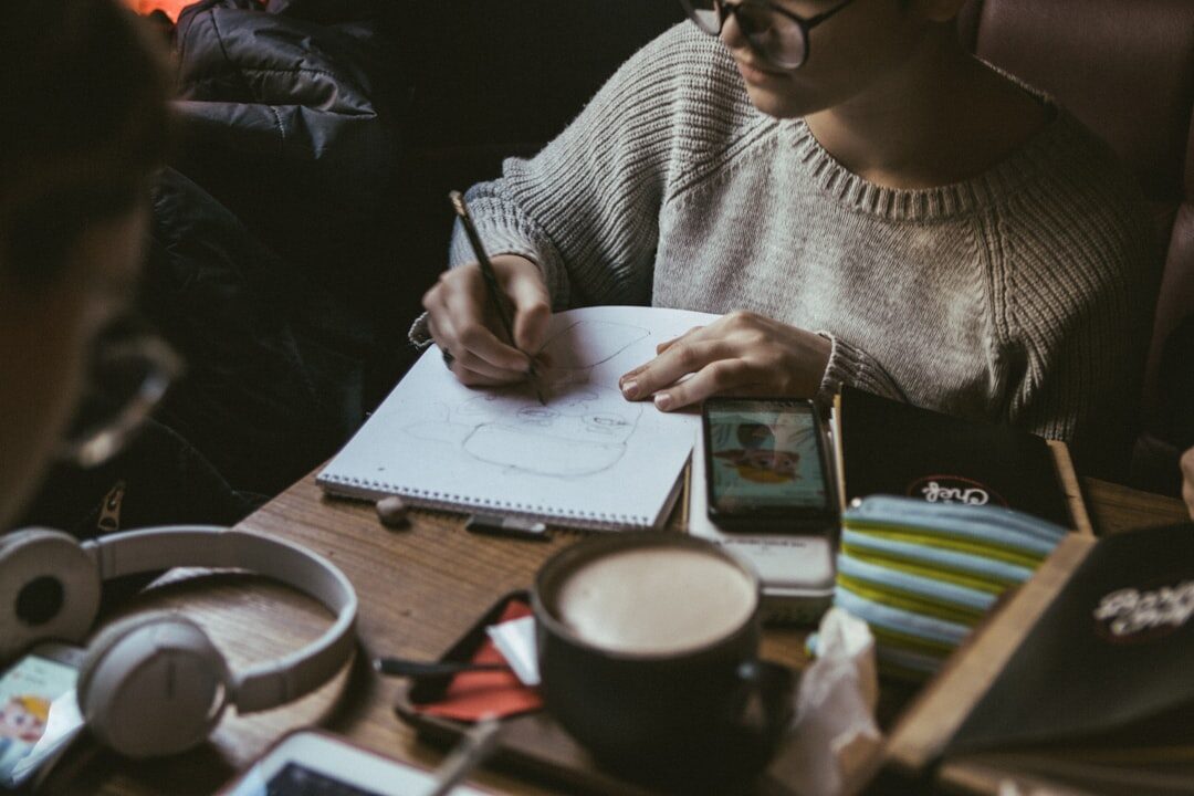 woman writing in notebook