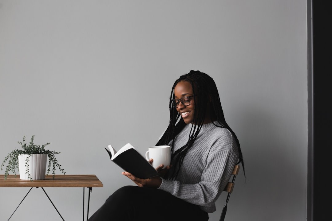 person reading self help book